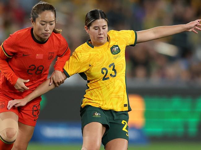 SYDNEY, AUSTRALIA - JUNE 03: Kyra Cooney-Cross of Australiacompete for the ball during the international friendly match between Australia Matildas and China PR at Accor Stadium on June 03, 2024 in Sydney, Australia. (Photo by Mark Metcalfe/Getty Images)