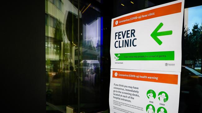 A sign directing visitors to a fever clinic at Gold Coast University Hospital. Picture: AFP.