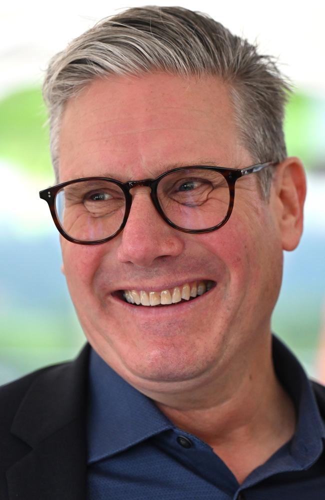 Labour Leader Sir Keir Starmer smiles as he speaks to media on the final day of campaigning at the West Regwm Farm on July 3, 2024 in Whitland, Wales. (Photo by Matthew Horwood/Getty Images)