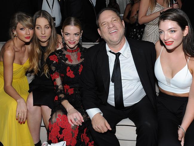 Harvey Weinstein mingles with  Taylor Swift, musician Este Haim, Jaime King and Lorde at a Golden Globes party.