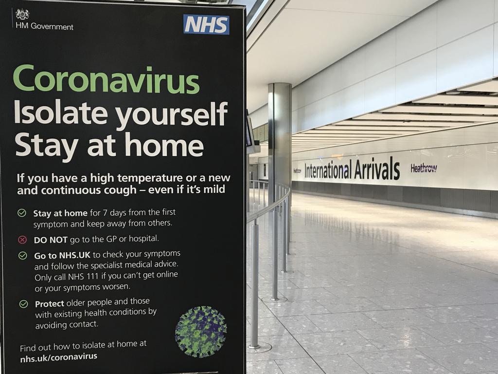 An NHS sign warns about coronavirus at Heathrow Airport. Picture: Kirsty Wigglesworth/AP