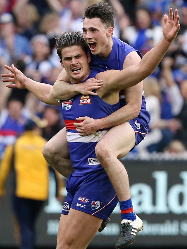 Tom Boyd and Toby McLean celebrate his iconic goal. Picture: Wayne Ludbey