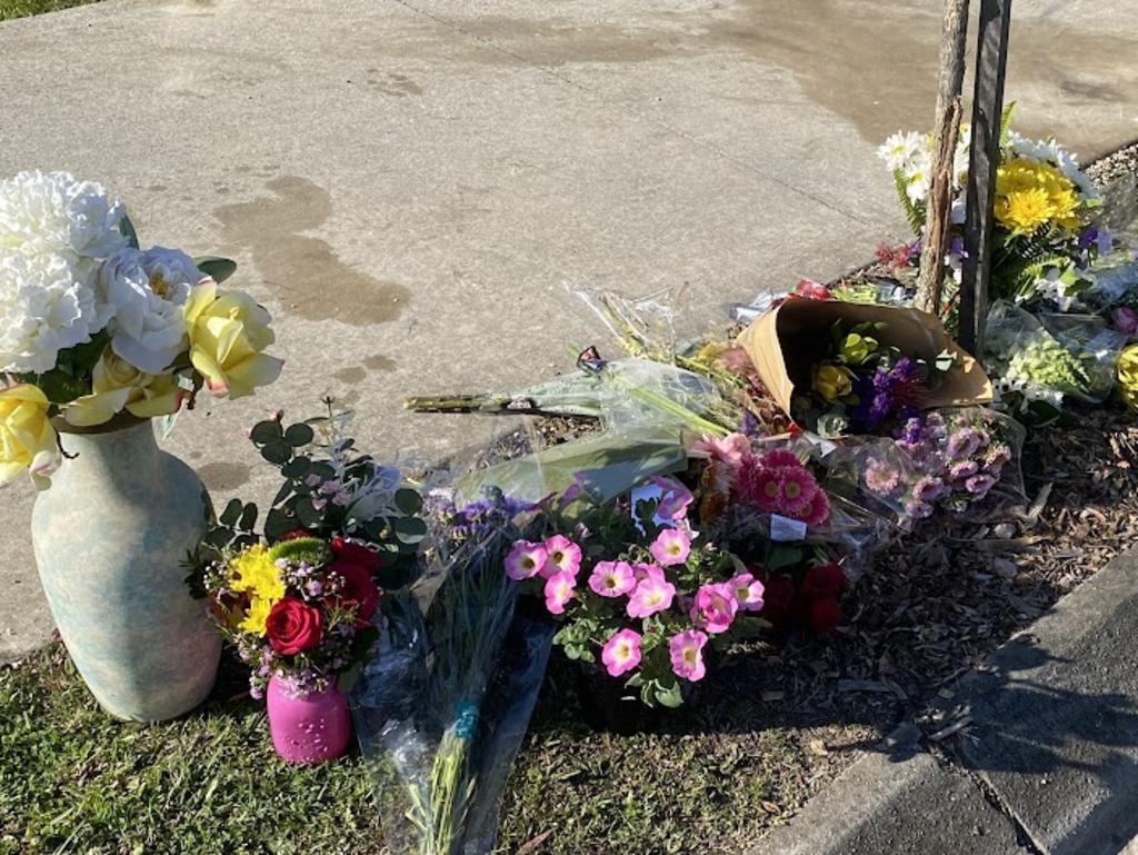 A flower tribute is growing at the scene where a 52-year-old was killed at Burnside. PHOTO: Eddie Franklin