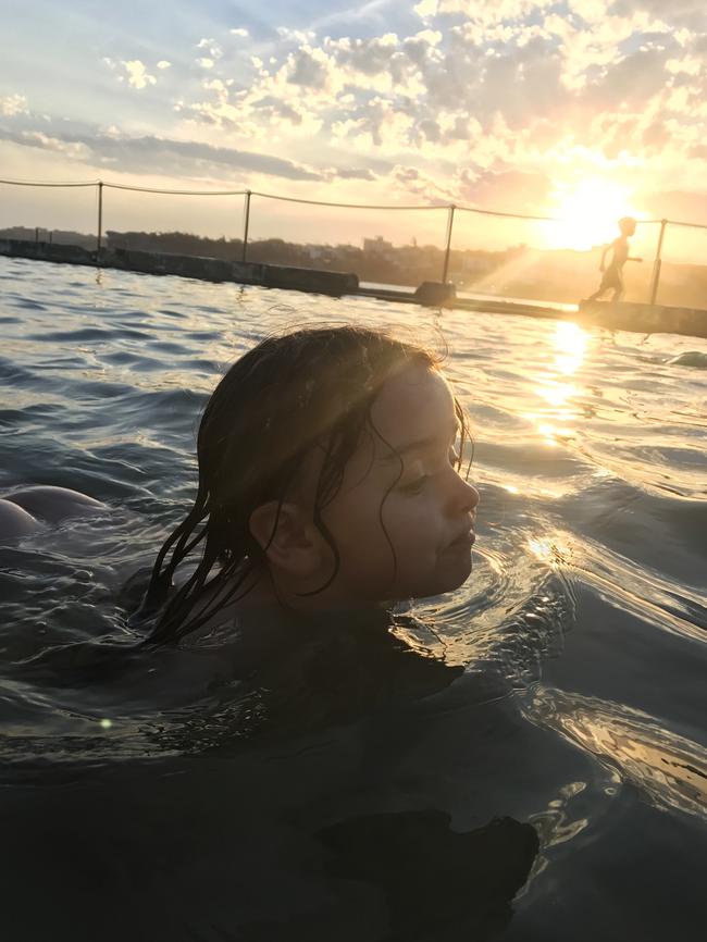 A three-year-old girl dog paddling in the children's pool at North Bondi. Pic: Paul Blackmore.