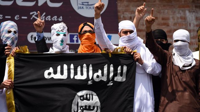 SRINAGAR, KASHMIR, INDIA, SRINAGAR, JAMMU AND KASHMIR, INDIA - 2019/06/05: Kashmiri Protesters hold an ISIS flag while making gestures during a protest in Srinagar. Indian forces in Srinagar used teargas smoke canisters and bullets to disperse hundreds of Protesters who took to streets after Eid-ul-Fitr prayers protesting against the Indian Rule in the region. (Photo by Idrees Abbas/SOPA Images/LightRocket via Getty Images)