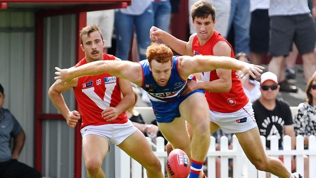 19/04/19 - SANFL: North Adelaide v Central District at Prospect Oval. Central's Murray Stephenson hovers over the ball. Picture: Tom Huntley