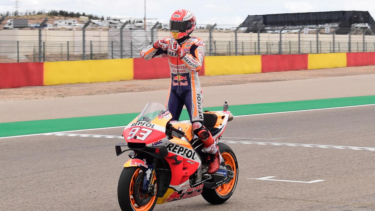Marc Marquez celebrates as he crosses the finish line in Aragon.