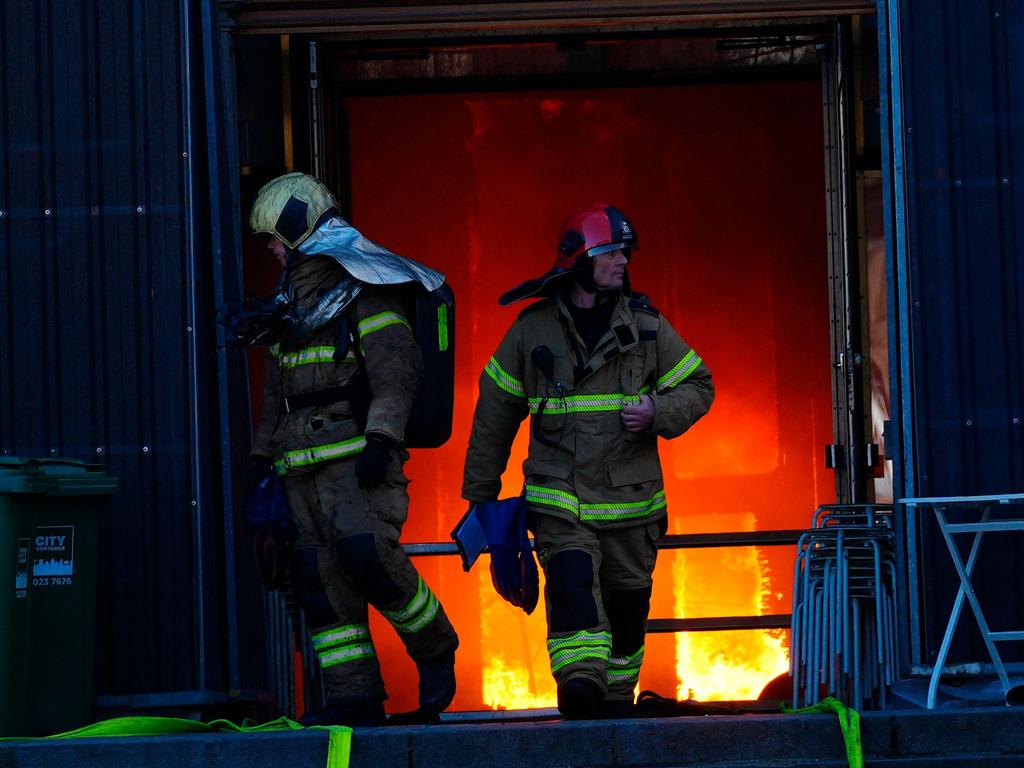 Firefighters work at the main entrance of the historic Boersen stock exchange building. Picture: Ida Marie Odgaard / Ritzau Scanpix / AFP