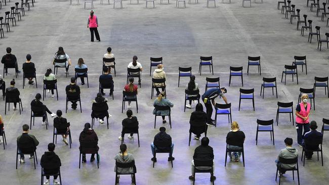 Students wait for their turn to receive their first dose of the Pfizer Covid-19 vaccine in Sydney in August. Picture: AFP