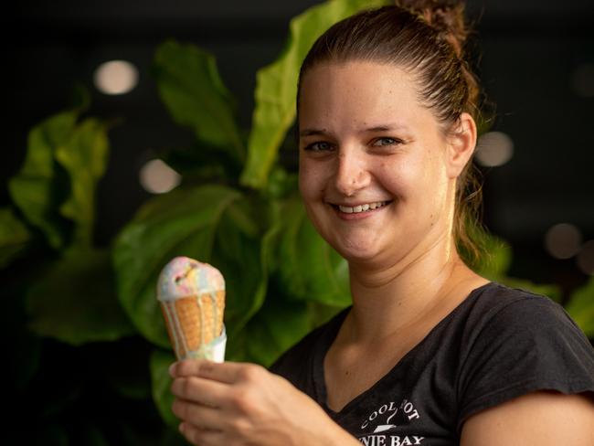 Fannie Bay Cool Spot sales assistant Clemence Le Bot takes on a rapidly melting ice cream. Picture: Che Chorley