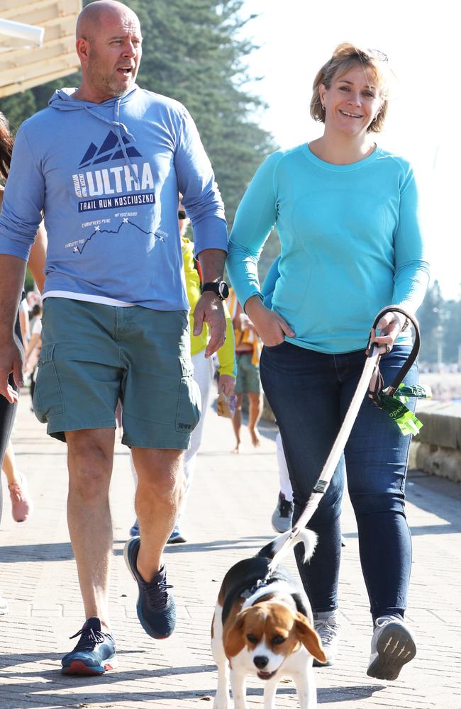 Zali Steggall pictured with her husband Tim Irving and their dog Charli at Manly Beach. Picture: Damian Shaw