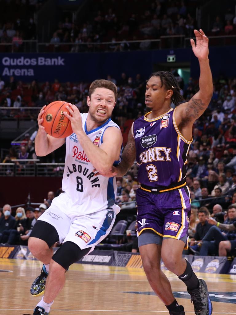 Jaylen Adams defends against Matthew Dellavedova of Melbourne United.