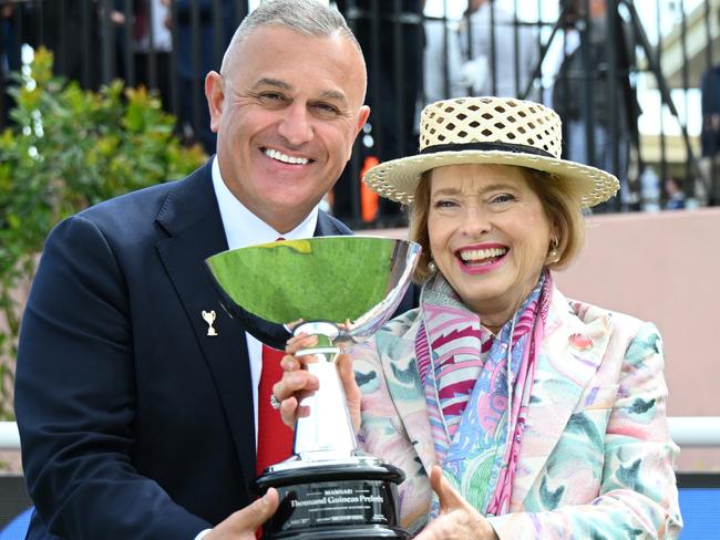 MELBOURNE, AUSTRALIA - OCTOBER 19: Trainer Gai Waterhouse poses with chairman of MRC John Kanga after Too Darn Lizzie won Race 6, the Manhari Thousand Guineas Prelude - Betting Odds  during Melbourne Racing at Caulfield Racecourse on October 19, 2024 in Melbourne, Australia. (Photo by Vince Caligiuri/Getty Images)