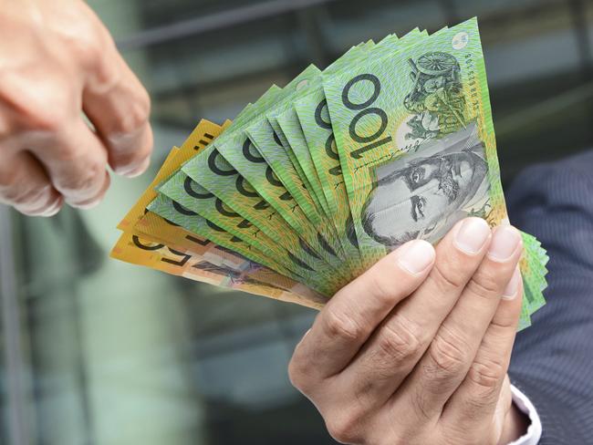 Businessmen passing money, Australia dollar bills, tax refund, generic