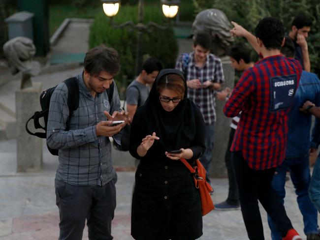 Iranians play Pokemon Go in northern Tehran's Mellat Park. Iran was quick to ban the global gaming craze citing security concerns. Picture: AFP