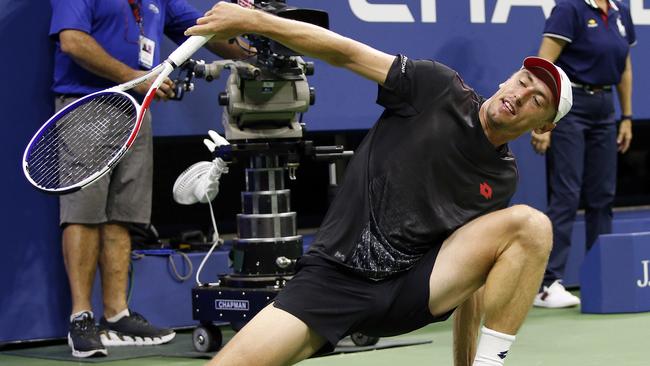 John Millman stumbles during his epic win (AP Photo/Jason DeCrow)