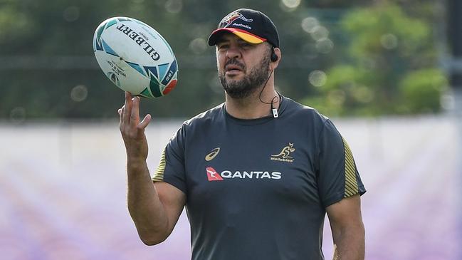 Australia's head coach Michael Cheika balances on his fingers during a training session in Urayasu, on September 27, 2019, during the Japan 2019 Rugby World Cup. (Photo by William WEST / AFP)