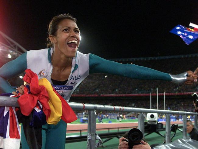 Cathy Freeman celebrates her win in the womens 400 final at the 2000 Sydney Olympic Games. Picture: Craig Borrow.