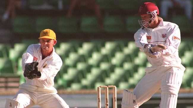 Andrew Symonds cuts past wicketkeeper Adam Gilchrist in the Sheffield Shield final in 1997