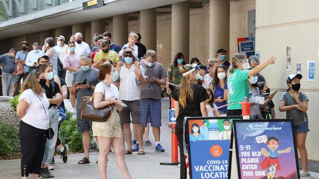 The line-up for Covid-19 vaccinations at Brisbane Convention Centre. Picture: Liam Kidston