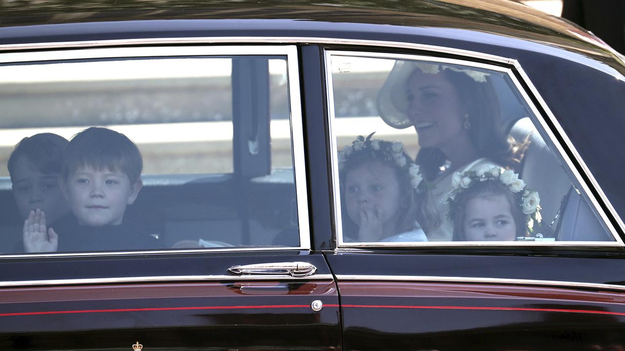 Kate, the Duchess of Cambridge arrives with Prince George, left and Princess Charlotte, right, for the wedding. Picture: AP