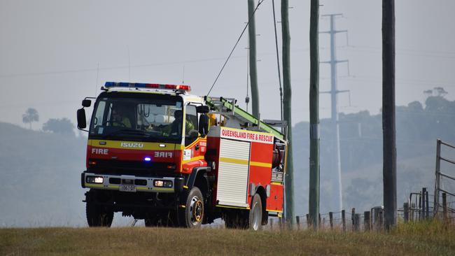 Queensland Fire and Emergency Services are at the scene of a car on fire in the yard of a Dawson Highway residence. Picture: Zizi Averill