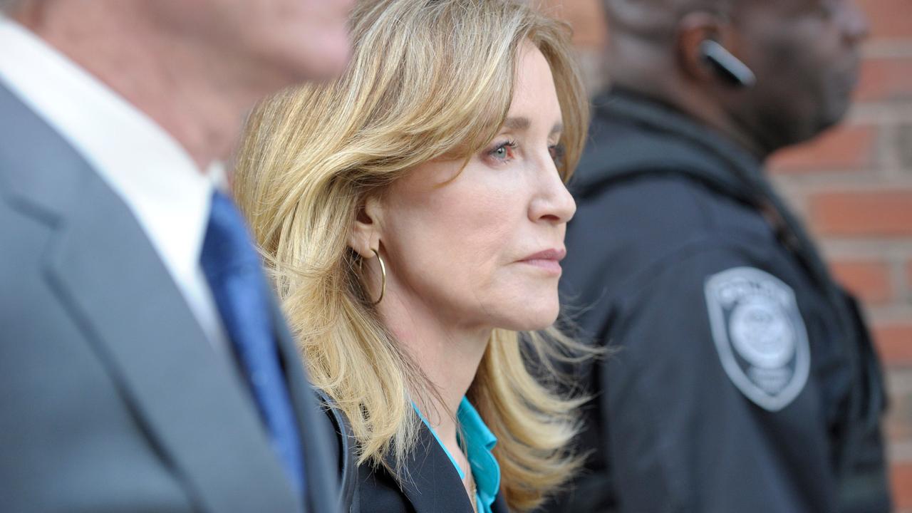 Actress Felicity Huffman exits the courthouse after facing charges for allegedly conspiring to commit mail fraud and other charges in the college admissions scandal at the John Joseph Moakley United States Courthouse in Boston on April 3, 2019. Picture: Joseph Prezioso / AFP.