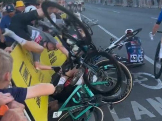 A devastating crash has marred Saturday’s Tour Down Under, leaving a fan hospitalised with serious injuries.