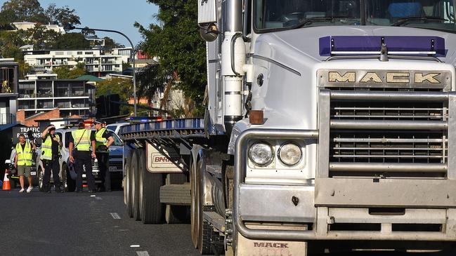 The scene after a cyclist was killed on the corner of Hudson Rd and Albion Overpass in Albion. Friday August 10, 2018. (AAP image, John Gass)