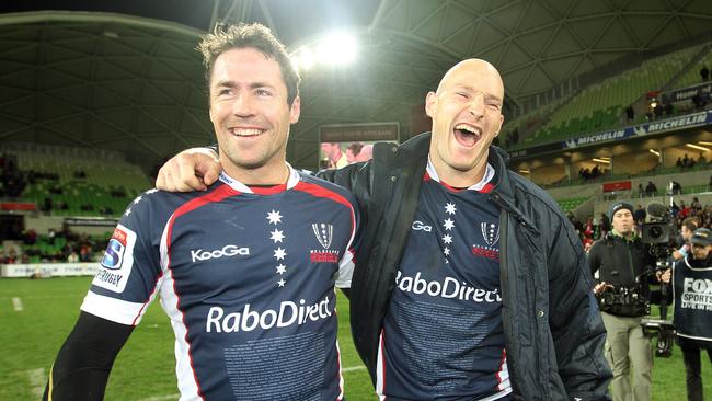 Stirling Mortlock and Julian Huxley share a laugh after both playing their final game for the Rebels.