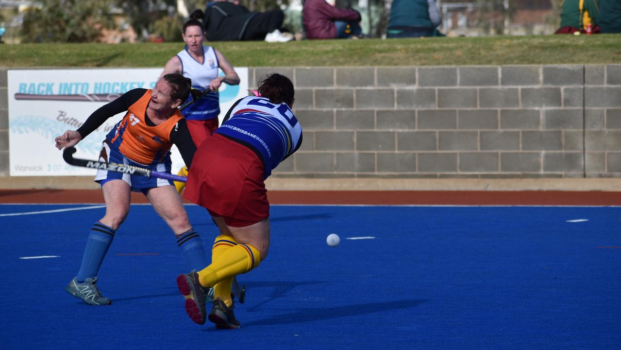 Judy Harrap in possession for Brisbane in their match-up with Maryborough at the 2021 Queensland Hockey Women's Masters Championships.