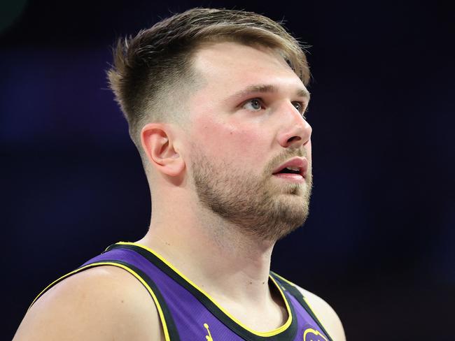 LOS ANGELES, CALIFORNIA - FEBRUARY 25: Luka Doncic #77 of the Los Angeles Lakers looks on during the first half of a game against the Dallas Mavericks at Crypto.com Arena on February 25, 2025 in Los Angeles, California.   Sean M. Haffey/Getty Images/AFP (Photo by Sean M. Haffey / GETTY IMAGES NORTH AMERICA / Getty Images via AFP)