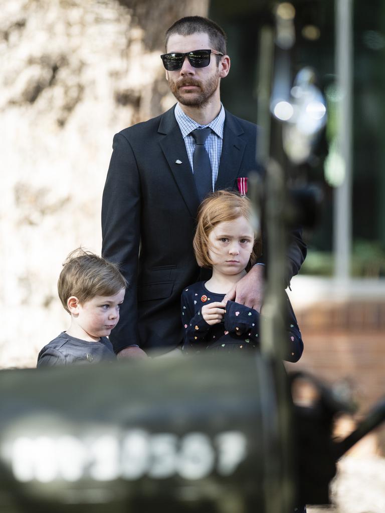 Taylor Digweed with kids Henry and Lucy Digweed watch the march to the Mothers' Memorial for the mid-morning Toowoomba Anzac Day service, Tuesday, April 25, 2023. Picture: Kevin Farmer