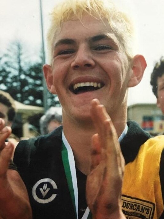 Hodge celebrates Colac's under-18 premiership in 2000.