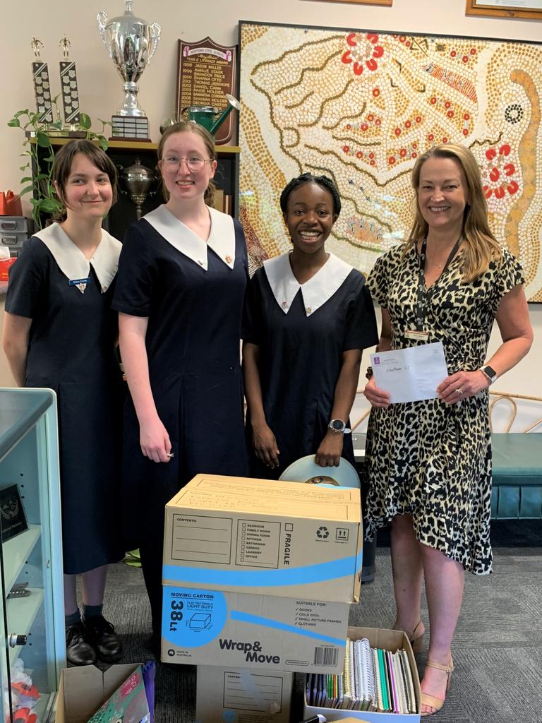 Glennie students donating stationery and funds to Newtown State School (from left) Khloe Crane, Hannah Stunden and Sandra Miller with Newtown State School principal, Mrs Tania Angus.