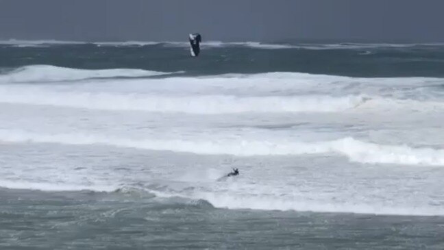 Kite surfer hits the waves as winter storm lashes Cronulla