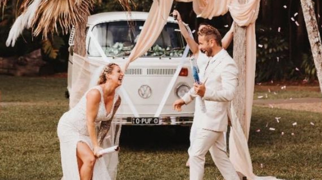 Newly weds, Mr and Mrs Everard capture the moment they surprised friends and family at their wedding with a gender reveal when Rochelle was 22 weeks pregnant. Picture: Wilde Collaborative Photography.