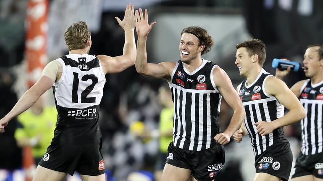 Jarrod Lienert celebrates the first goal of the match with Trent McKenzie, who had a massive influence. Picture: Sarah Reed