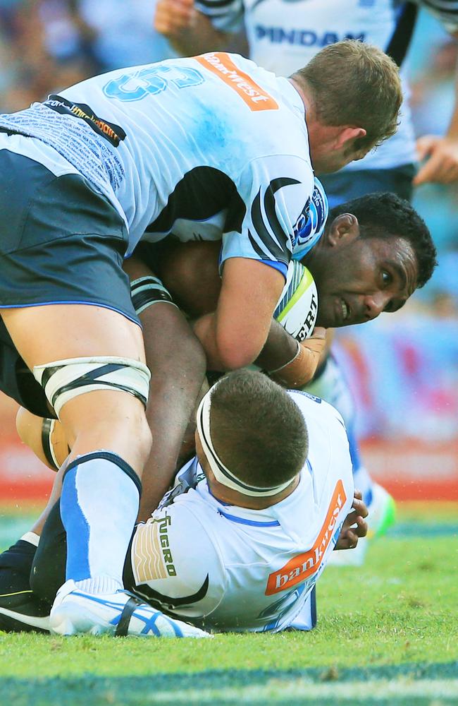 Waratahs No. 8 Wycliff Palu is stopped by the Force defence.