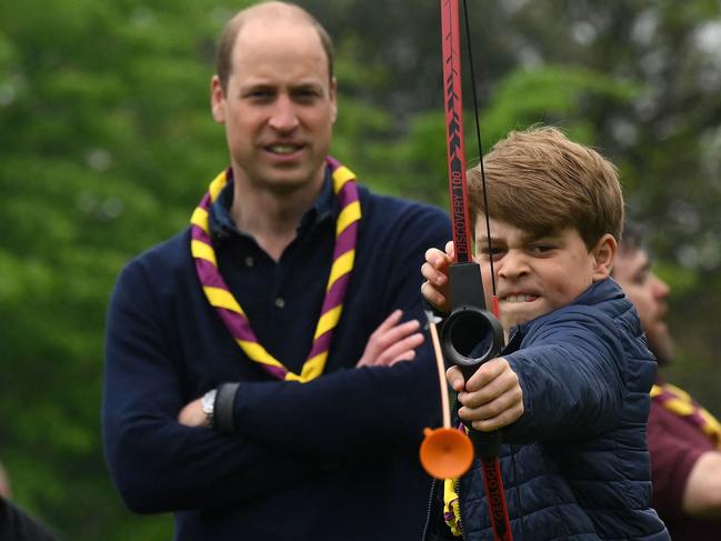 Prince George trying his hand at archery last May. Picture: Daniel Leal / POOL / AFP