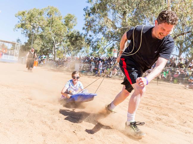 The Henley on Todd boogie board race was a bumpy and dusty ride for passengers at the Alice Springs event. August 19 2017. Photo: EMMA MURRAY