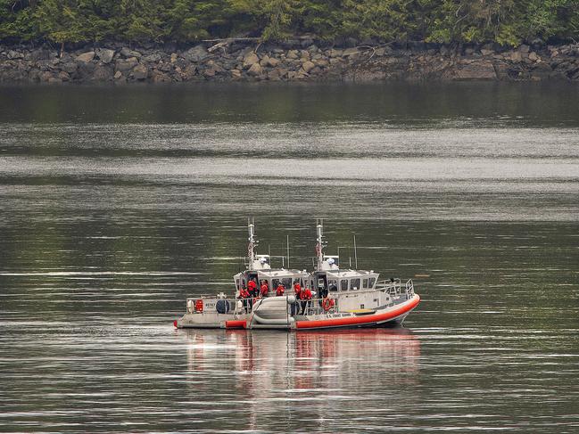 Two US Coast Guard 45-foot response boats drift through George Inlet as part of a search effort. Picture: AP