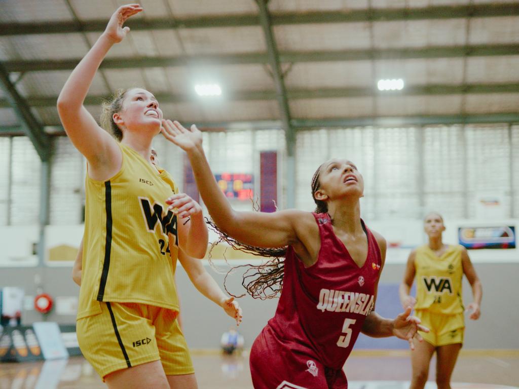 Western Australia's Harriet Ford and Queensland's Lulu Twidale battle for the ball at the Under-20 National Championships. Picture: Lara Sinclair