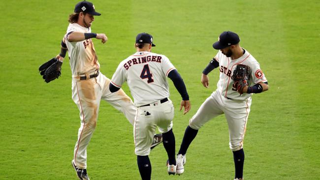 Marwin Gonzalez, Josh Reddick and George Springer celebrate after the Houston Astros’ win.