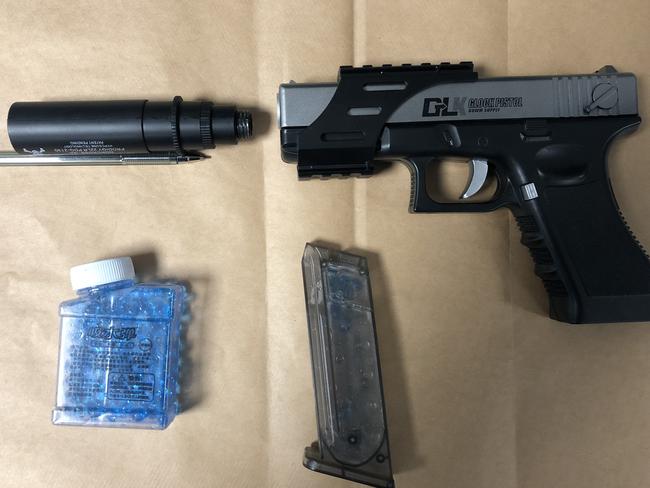 A Glock-18 replica ‘Gel Blaster’ pistol along with a silencer and ‘ammunition’ seized from a man by police on the northern beaches. Picture: NSW Police