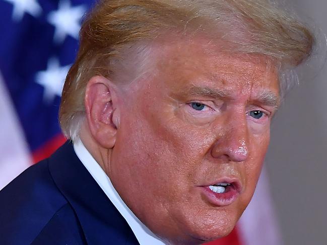 US President Donald Trump leaves after speaking during election night in the East Room of the White House in Washington, DC, early on November 4, 2020. (Photo by MANDEL NGAN / AFP)