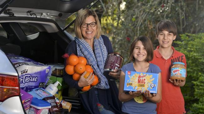 Costco fans keen for new store opening. Linda Carter with children Tessa and Paul. Picture: Cordell Richardson