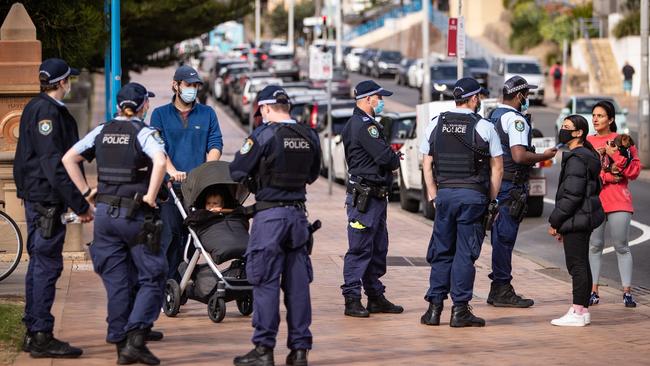 Police officers were cracking down to ensure people were wearing masks. Picture: Julian Andrews