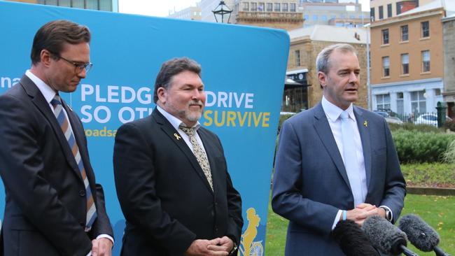 RACT CEO Mark Mugnaioni, Safer Australian Roads and Highways president Peter Frazer and Infrastructure and Transport Minister Micheal Ferguson at a road safety media announcement in Hobart on Tuesday, May 17, 2022