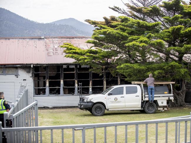 Police and fire investigators at the site of the overnight fire at Cosgrove High School. Picture: RICHARD JUPE